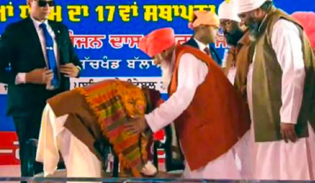 pm modi touched feet